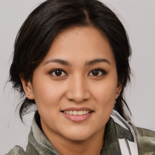 Joyful white young-adult female with medium  brown hair and brown eyes
