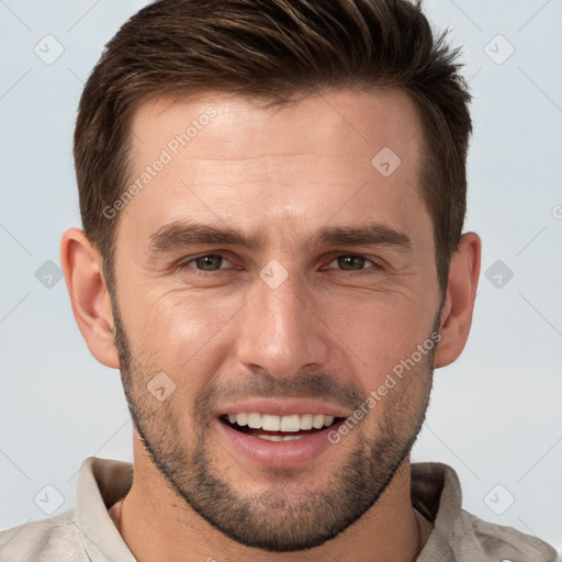 Joyful white adult male with short  brown hair and brown eyes