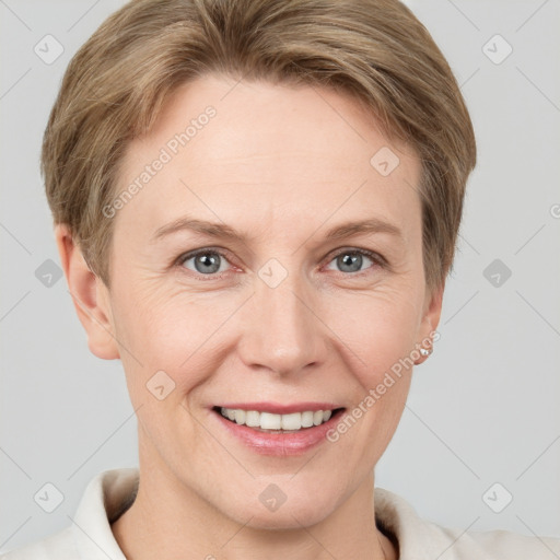 Joyful white adult female with short  brown hair and grey eyes