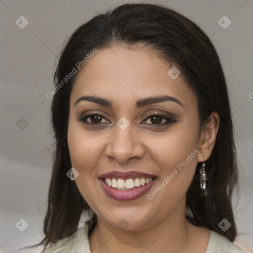 Joyful latino young-adult female with medium  brown hair and brown eyes