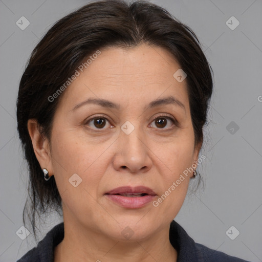 Joyful white adult female with medium  brown hair and brown eyes