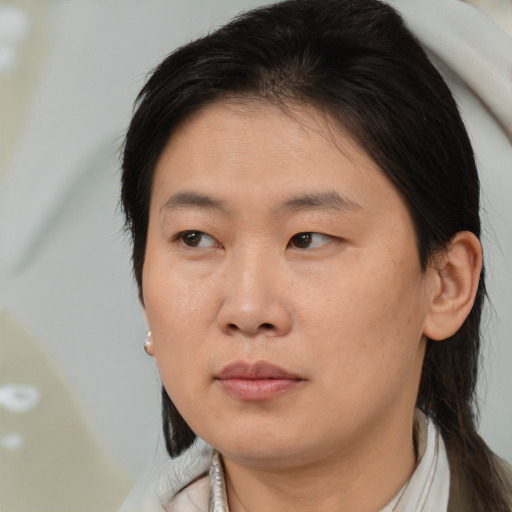 Neutral asian young-adult female with medium  brown hair and brown eyes