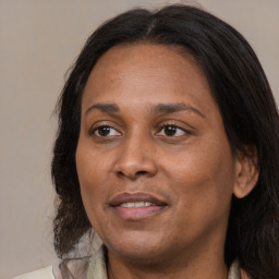 Joyful black young-adult female with medium  brown hair and brown eyes