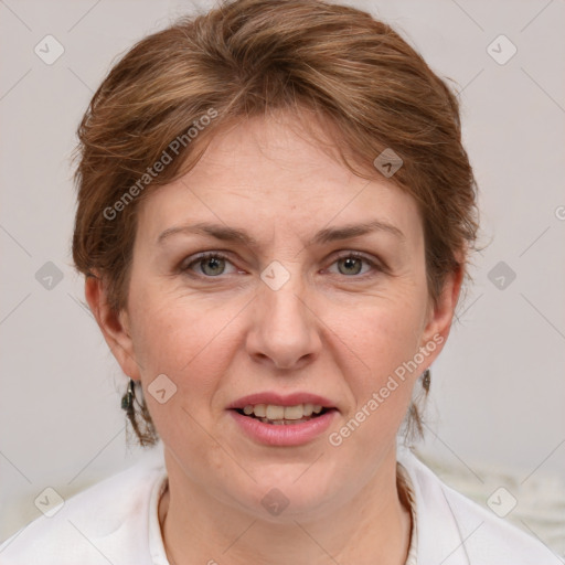 Joyful white adult female with short  brown hair and grey eyes