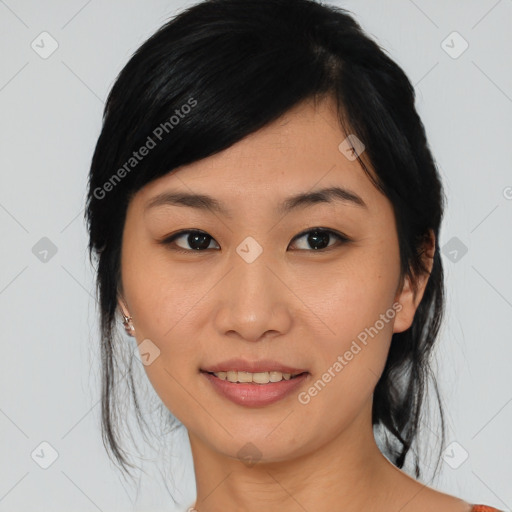 Joyful asian young-adult female with medium  black hair and brown eyes