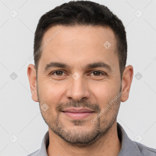 Joyful white adult male with short  brown hair and brown eyes