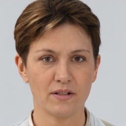 Joyful white adult female with short  brown hair and brown eyes