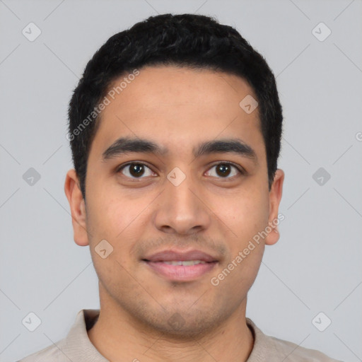 Joyful latino young-adult male with short  black hair and brown eyes