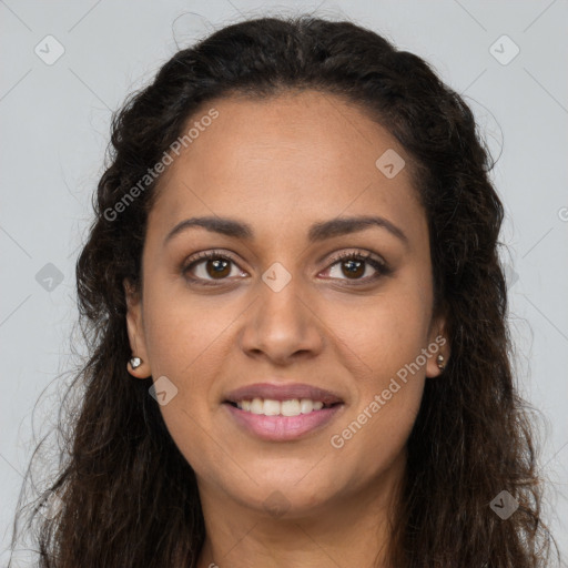 Joyful latino young-adult female with long  brown hair and brown eyes