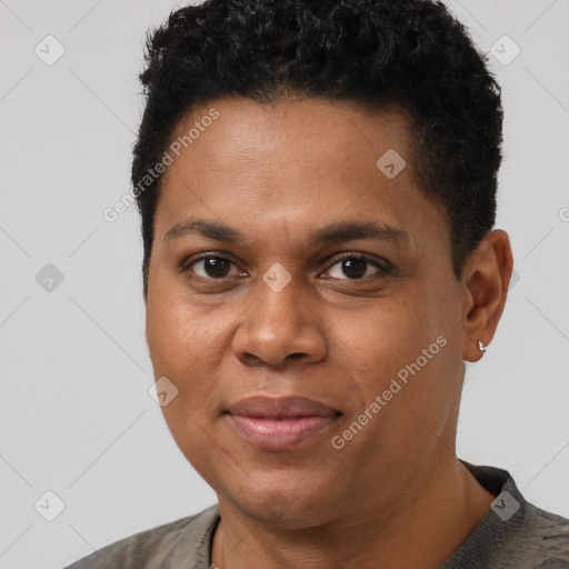 Joyful black young-adult male with short  black hair and brown eyes