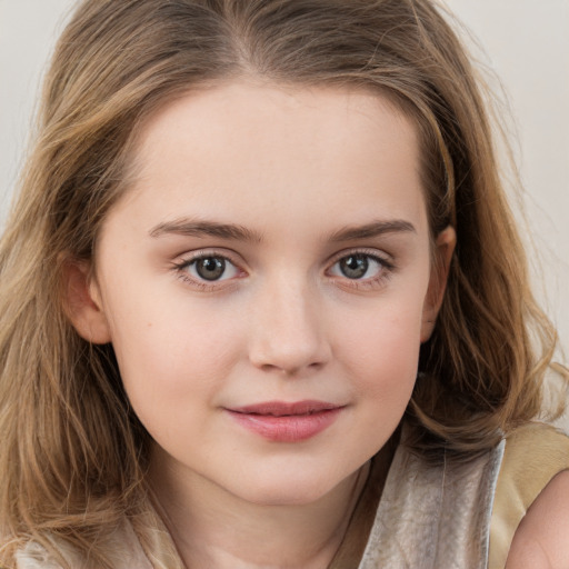 Joyful white child female with long  brown hair and brown eyes