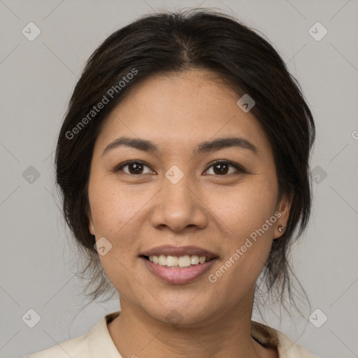 Joyful latino young-adult female with medium  brown hair and brown eyes