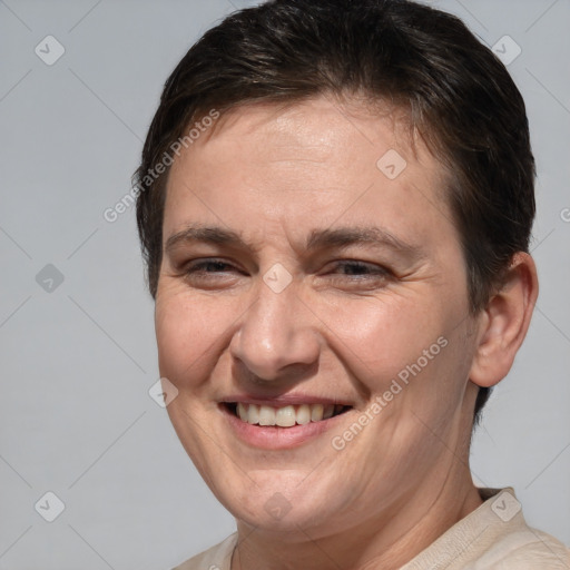 Joyful white adult female with short  brown hair and brown eyes