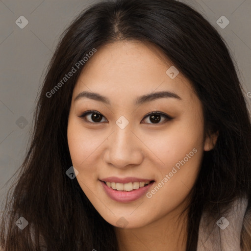 Joyful asian young-adult female with long  brown hair and brown eyes