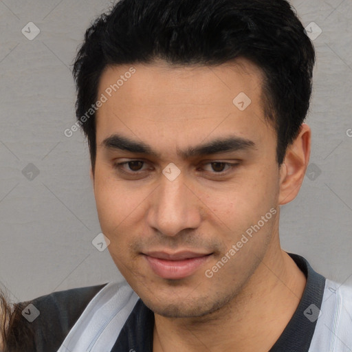 Joyful asian young-adult male with short  black hair and brown eyes