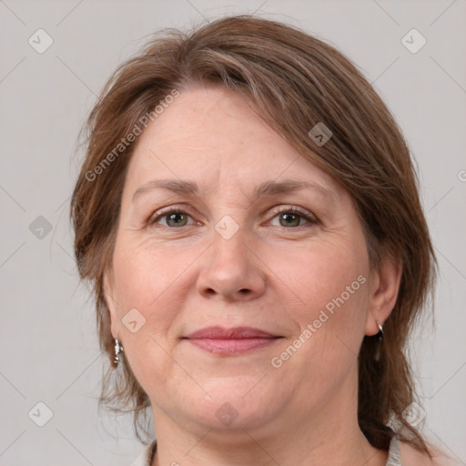 Joyful white adult female with medium  brown hair and grey eyes