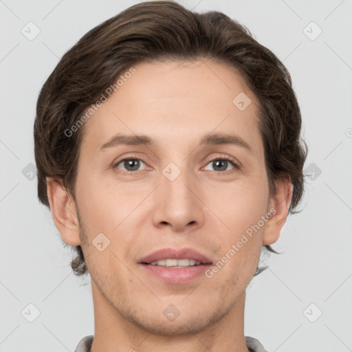 Joyful white adult male with short  brown hair and grey eyes