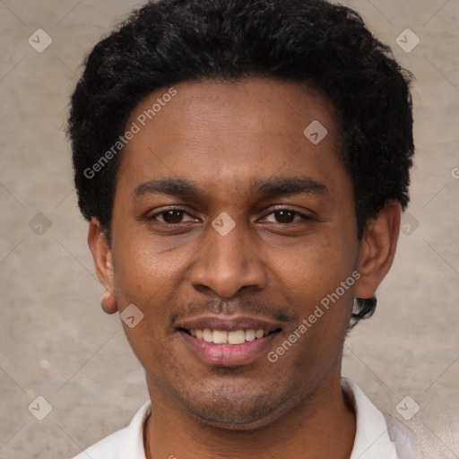 Joyful black young-adult male with short  black hair and brown eyes