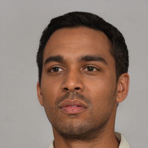 Neutral black young-adult male with short  black hair and brown eyes