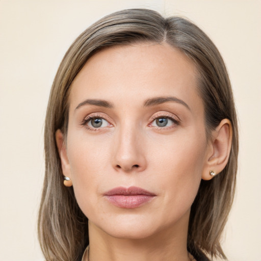 Neutral white young-adult female with long  brown hair and grey eyes