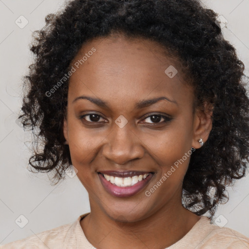 Joyful black young-adult female with long  brown hair and brown eyes