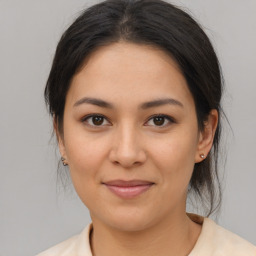 Joyful asian young-adult female with medium  brown hair and brown eyes