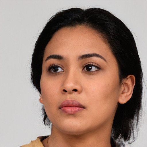 Neutral latino young-adult female with medium  black hair and brown eyes