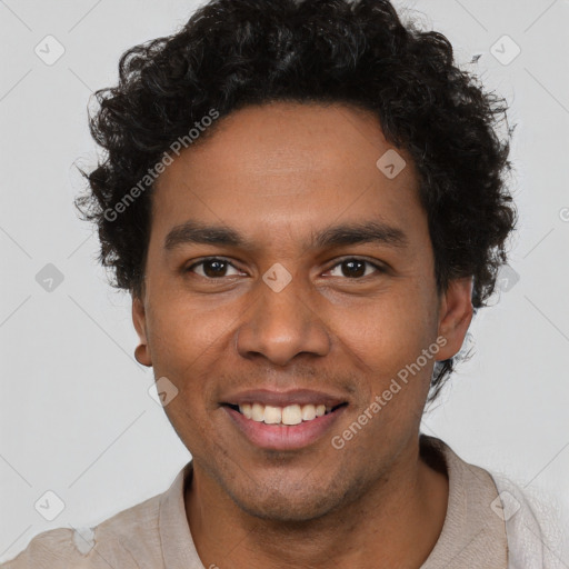 Joyful black young-adult male with short  brown hair and brown eyes