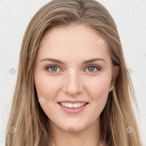 Joyful white young-adult female with long  brown hair and green eyes