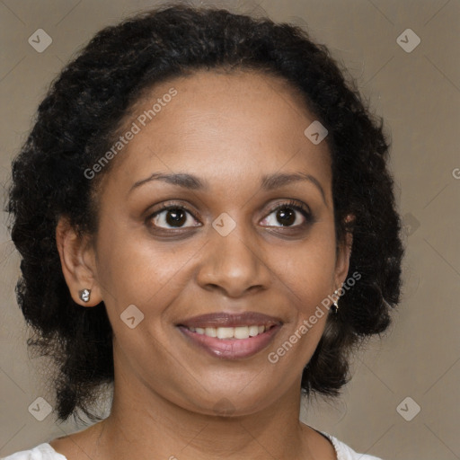 Joyful black adult female with medium  brown hair and brown eyes