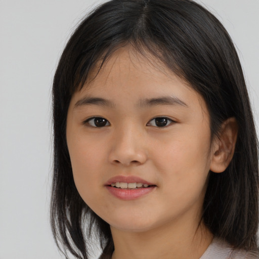 Joyful asian child female with medium  brown hair and brown eyes