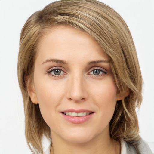 Joyful white young-adult female with medium  brown hair and blue eyes