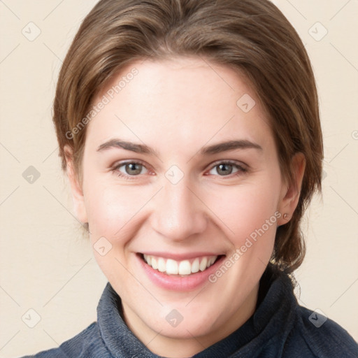 Joyful white young-adult female with medium  brown hair and blue eyes