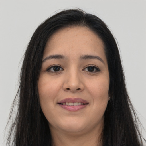 Joyful asian young-adult female with long  brown hair and brown eyes