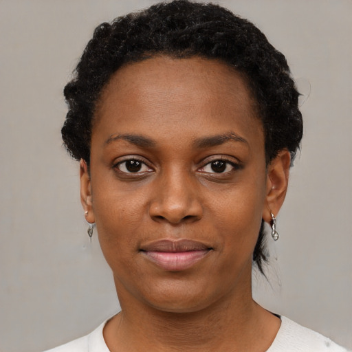 Neutral black young-adult female with short  black hair and brown eyes