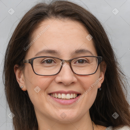 Joyful white adult female with medium  brown hair and brown eyes