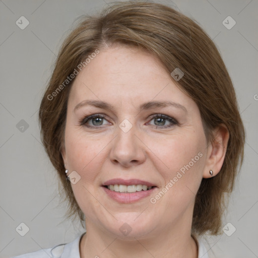 Joyful white adult female with medium  brown hair and grey eyes