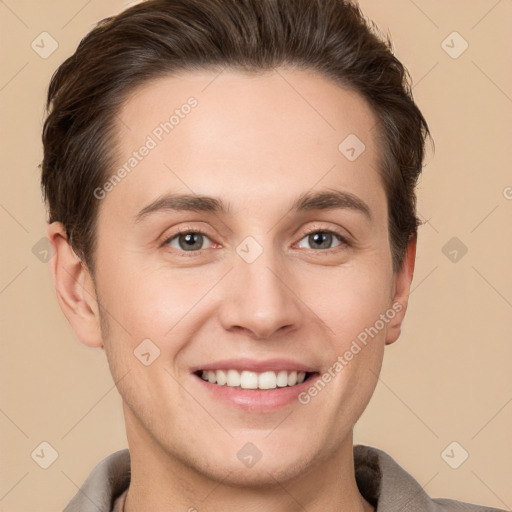 Joyful white young-adult male with short  brown hair and brown eyes