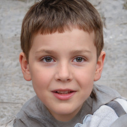 Joyful white child male with short  brown hair and brown eyes