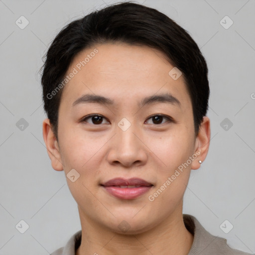 Joyful asian young-adult female with short  black hair and brown eyes