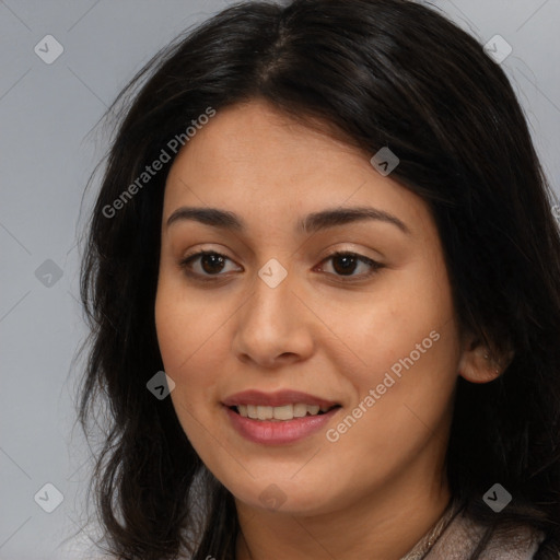 Joyful latino young-adult female with long  brown hair and brown eyes