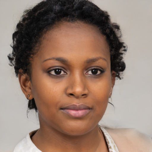 Neutral black young-adult female with short  brown hair and brown eyes