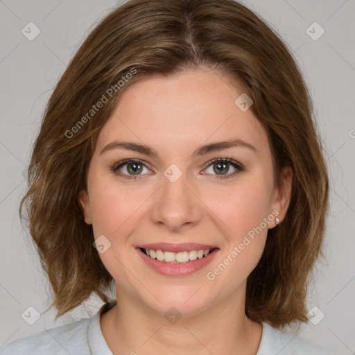 Joyful white young-adult female with medium  brown hair and green eyes