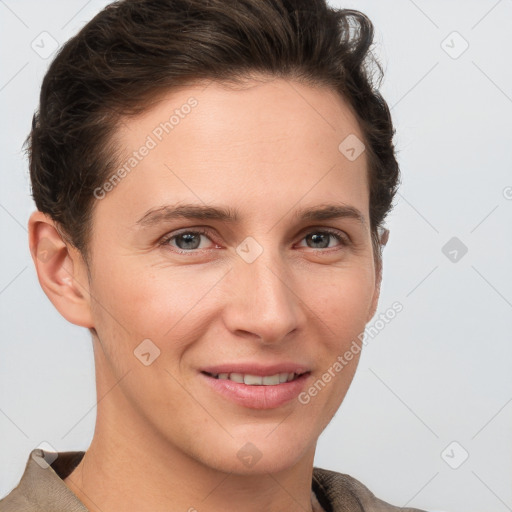 Joyful white young-adult female with short  brown hair and grey eyes