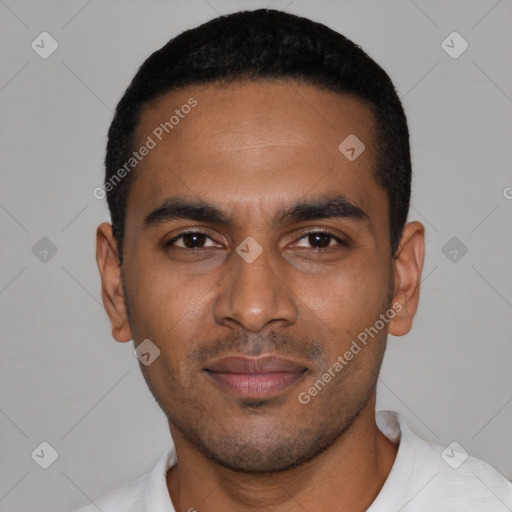 Joyful black young-adult male with short  black hair and brown eyes