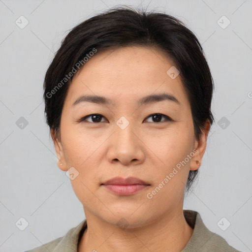 Joyful asian young-adult female with short  brown hair and brown eyes