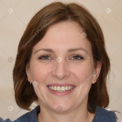 Joyful white adult female with medium  brown hair and blue eyes