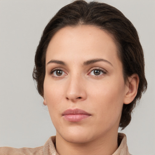 Neutral white young-adult female with short  brown hair and brown eyes