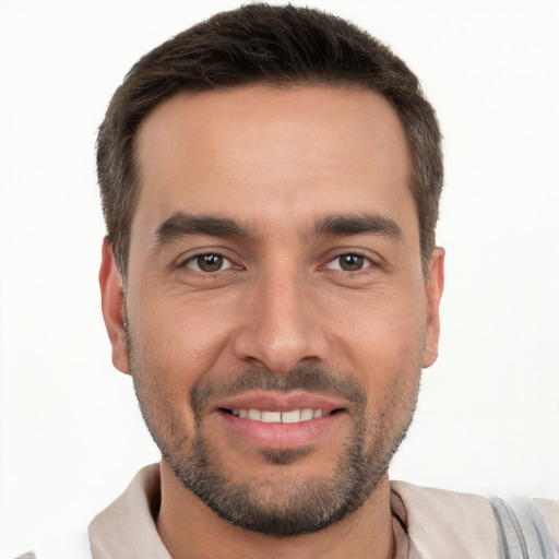 Joyful white young-adult male with short  brown hair and brown eyes