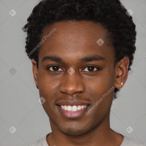 Joyful black young-adult male with short  brown hair and brown eyes